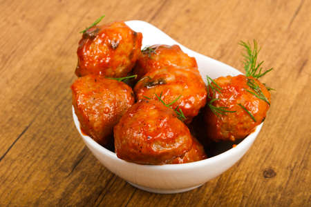Meat balls in tomato sauce served dillの写真素材