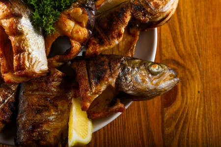 Grilled trout with lemon and parsleyの写真素材