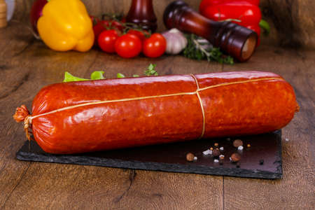 Pork sausages over wooden backgroundの写真素材