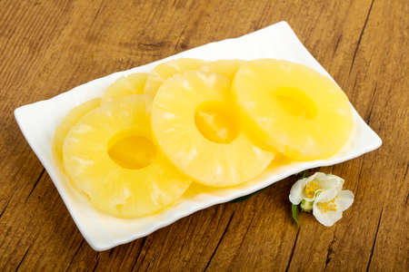 Canned pineapple rings in the bowlの写真素材