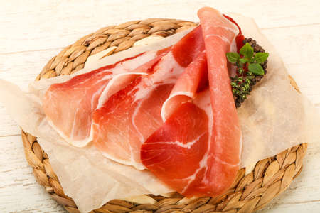 Spanish hamon ready for eat ovet the wooden backgroundの写真素材