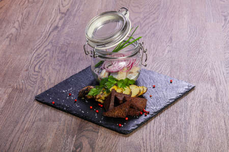 Pickled herring with bread and onionの写真素材