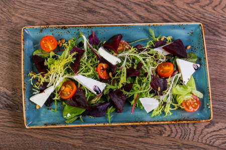 Cheese and beet root salad served tomatoの写真素材
