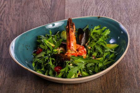 Seafood salad with avocado and rucolaの写真素材