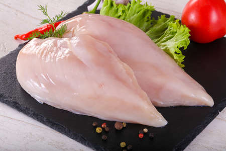 Raw chicken breast filletの写真素材