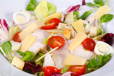 Salad with ham, eggs and tomatoの写真素材