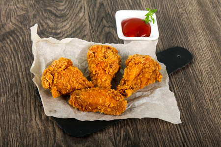 Crispy chicken wings with  ketchupの写真素材