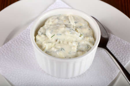 Tzatziki sauce over the wooden backgroundの写真素材