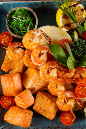 Fish and prawn plate served grilled vegetablesの写真素材