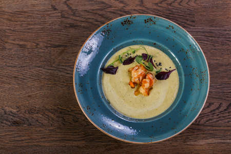 Broccoli cream soup with prawnの写真素材