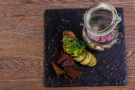 Pickled herring with bread and onionの写真素材