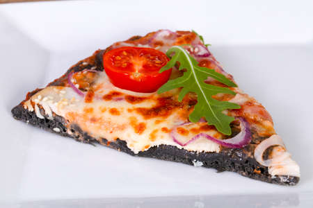 Pizza with ham, cheese and tomatoesの写真素材