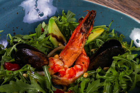 Seafood salad with avocado and rucolaの写真素材