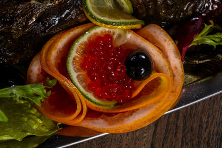 Red caviar with orange and limeの写真素材