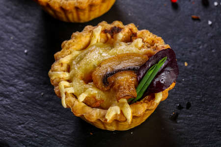 Canape with baked mushroom and cheese