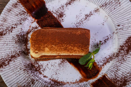 Tasty Tiramisu cake served mint leavesの写真素材