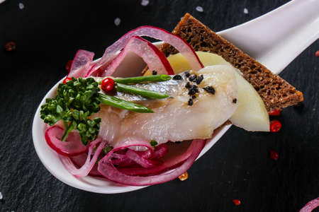 Herring snack wirh onion and bread