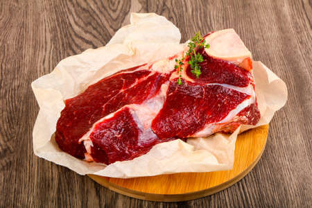 Raw beef with thyme - ready for cookingの写真素材