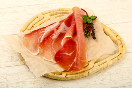 Spanish hamon ready for eat ovet the wooden backgroundの写真素材