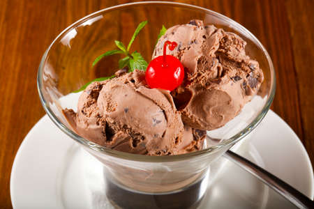 Chocolate ice-cream with mint and cherryの写真素材