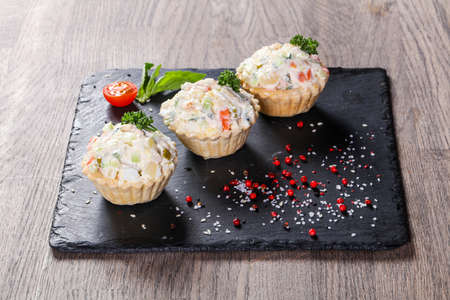 Russian salad canape with herbsの写真素材