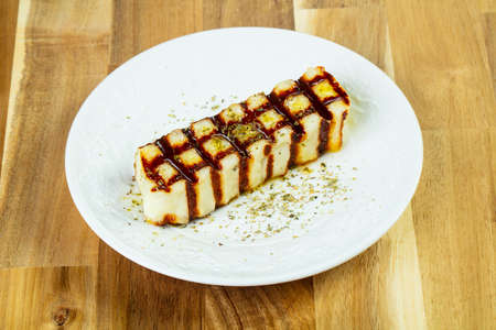 Grilled halloumi cheese with olive oilの写真素材