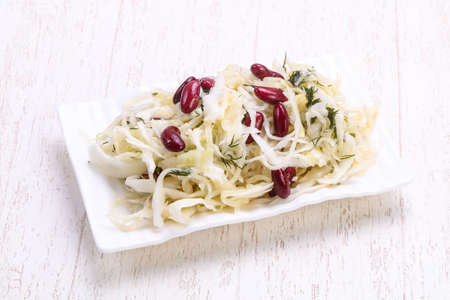 Traditional fermented cabbage sauerkraut in the bowlの写真素材