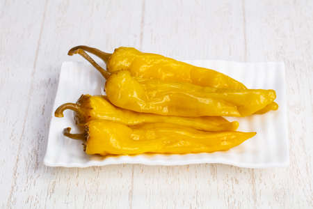 Tasty plate of salty pickled peppersの写真素材