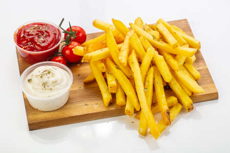 French potato with sauce over board