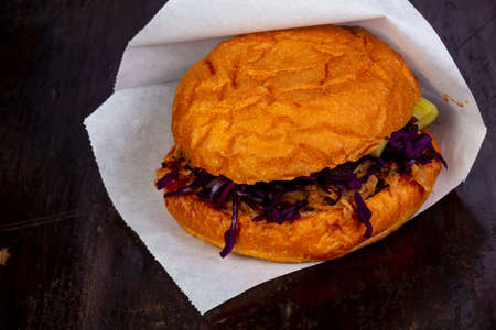 Burger with pulled pork and cabbage