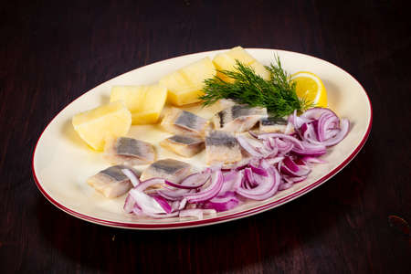 Herring with onion and potatoの写真素材