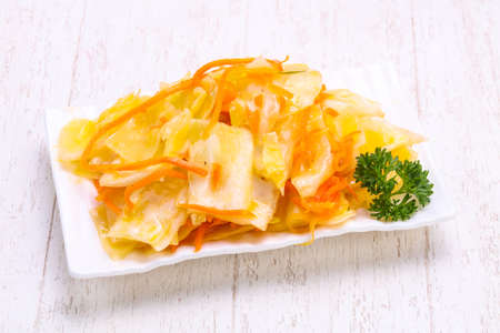 Traditional fermented cabbage sauerkraut in the bowlの写真素材