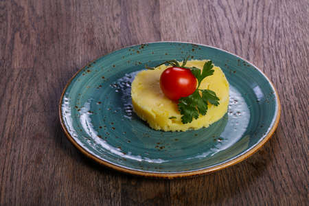 Mashed potato served tomato and parsley