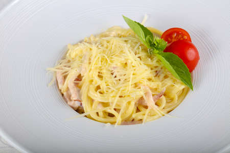 Pasta Carbonara served Basil leavesの写真素材