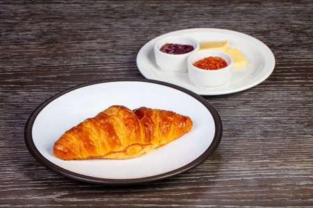 Tasty french croissant with cheese and jamの写真素材