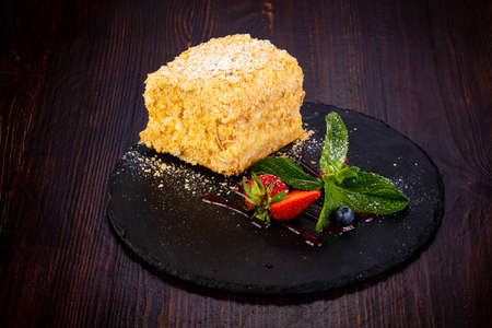 Napoleon layered cake served mint and strawberry