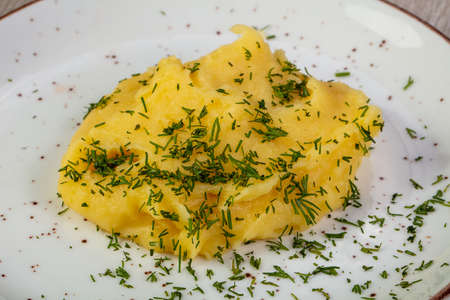 Mushed potato with dill in the plateの写真素材