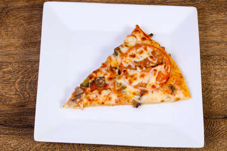 Pizza with meat and cheese