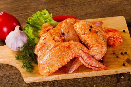 Raw marinated chicken wings for grill and bbqの写真素材