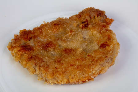 Roasted pork schnitzel in the plate