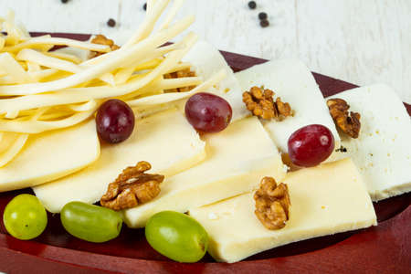 Caucasian cheeses plate with grape and nuts