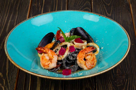 Black seafood pasta with prawn and musselsの写真素材