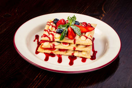 Waffel cake with berries and mintの写真素材
