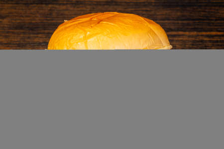 Tasty hot burger over wooden backgroundの写真素材