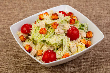 Caesar salad with chicken and parmesan cheeseの写真素材