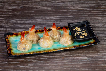 Delicious dim sum with shrimps and sauceの写真素材