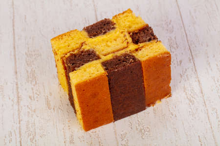 Tasty Sponge cake ower wooden background