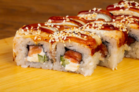 Delicious eel rolls with sesame and cheese