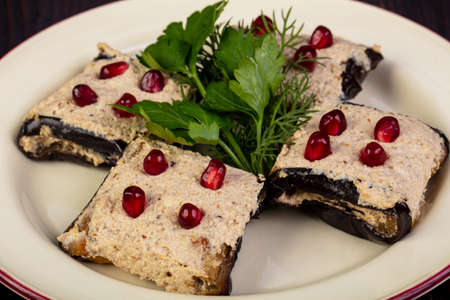 Stuffed eggplant roll served pomegranetの写真素材