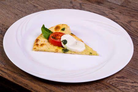 Pizza Caprese with basil and mozarella